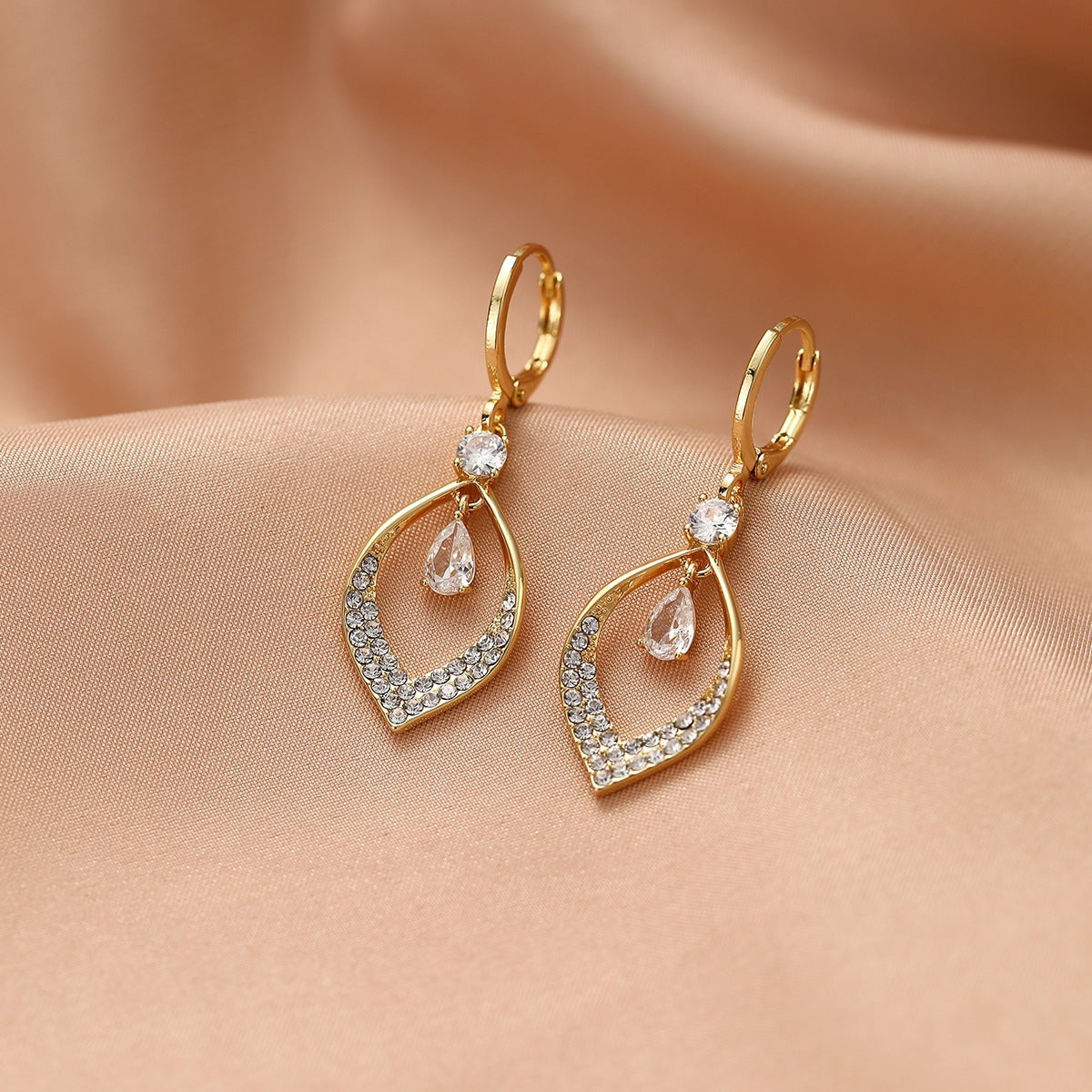 A Woman With Elegant Zircon Water Drop Tassel Earrings